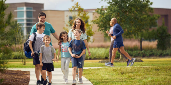 Parents walk students home from school in Bridgeland.